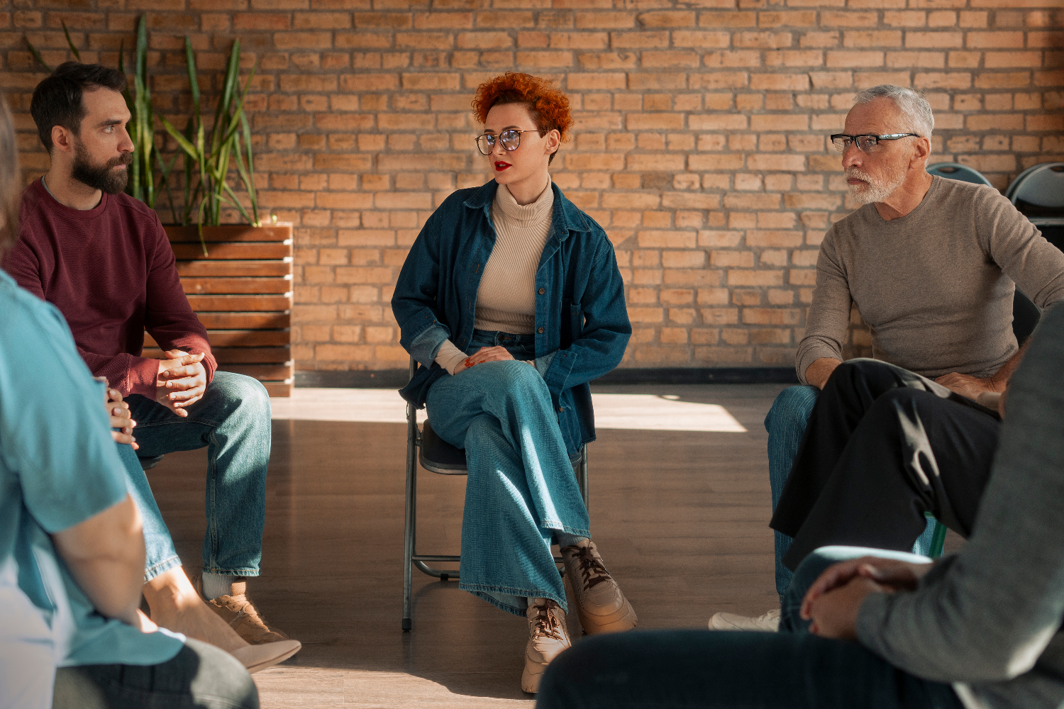 A therapy group sitting together in a circle