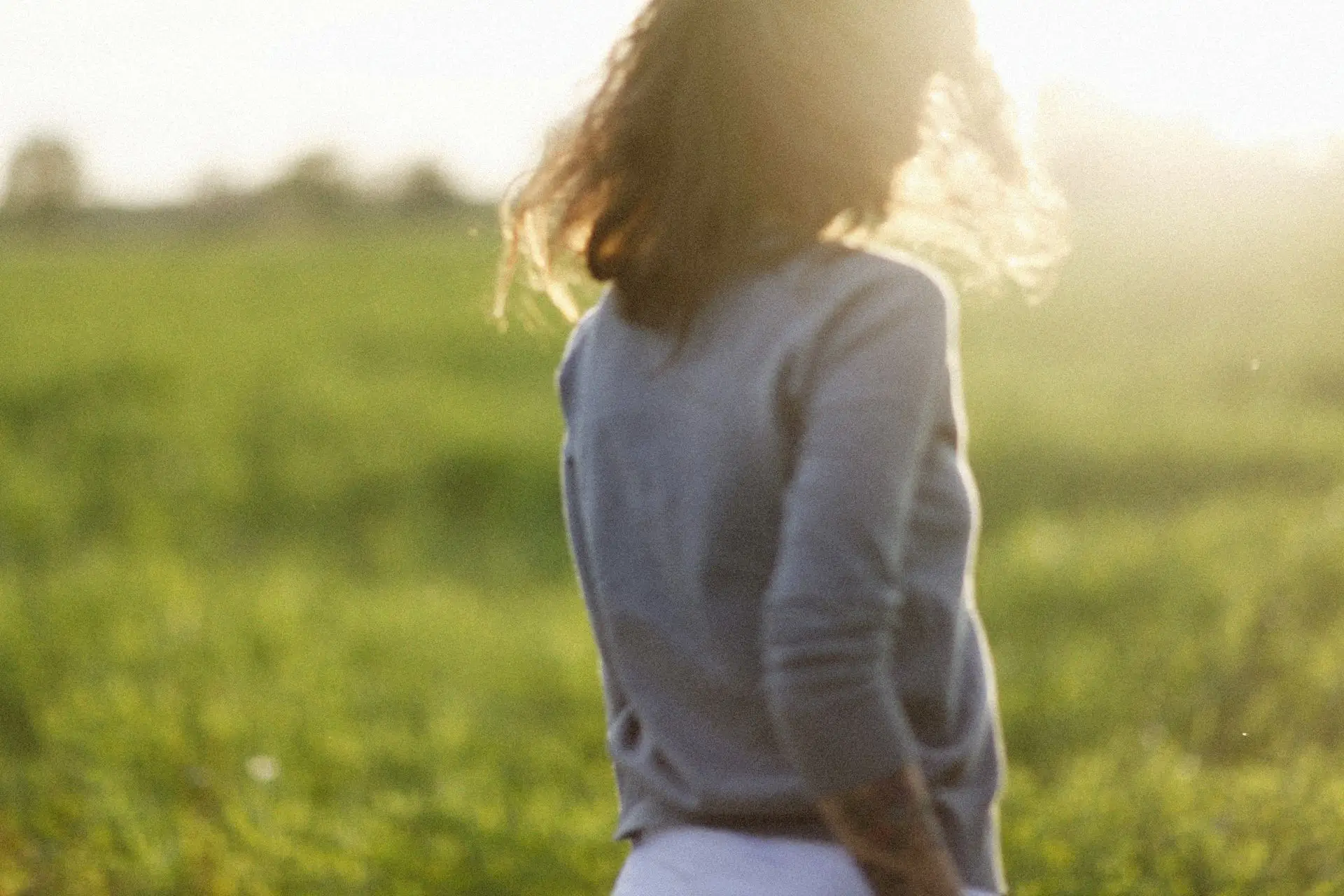 Person in warm natural light finding peace, representing EMDR trauma therapy in Vaughan