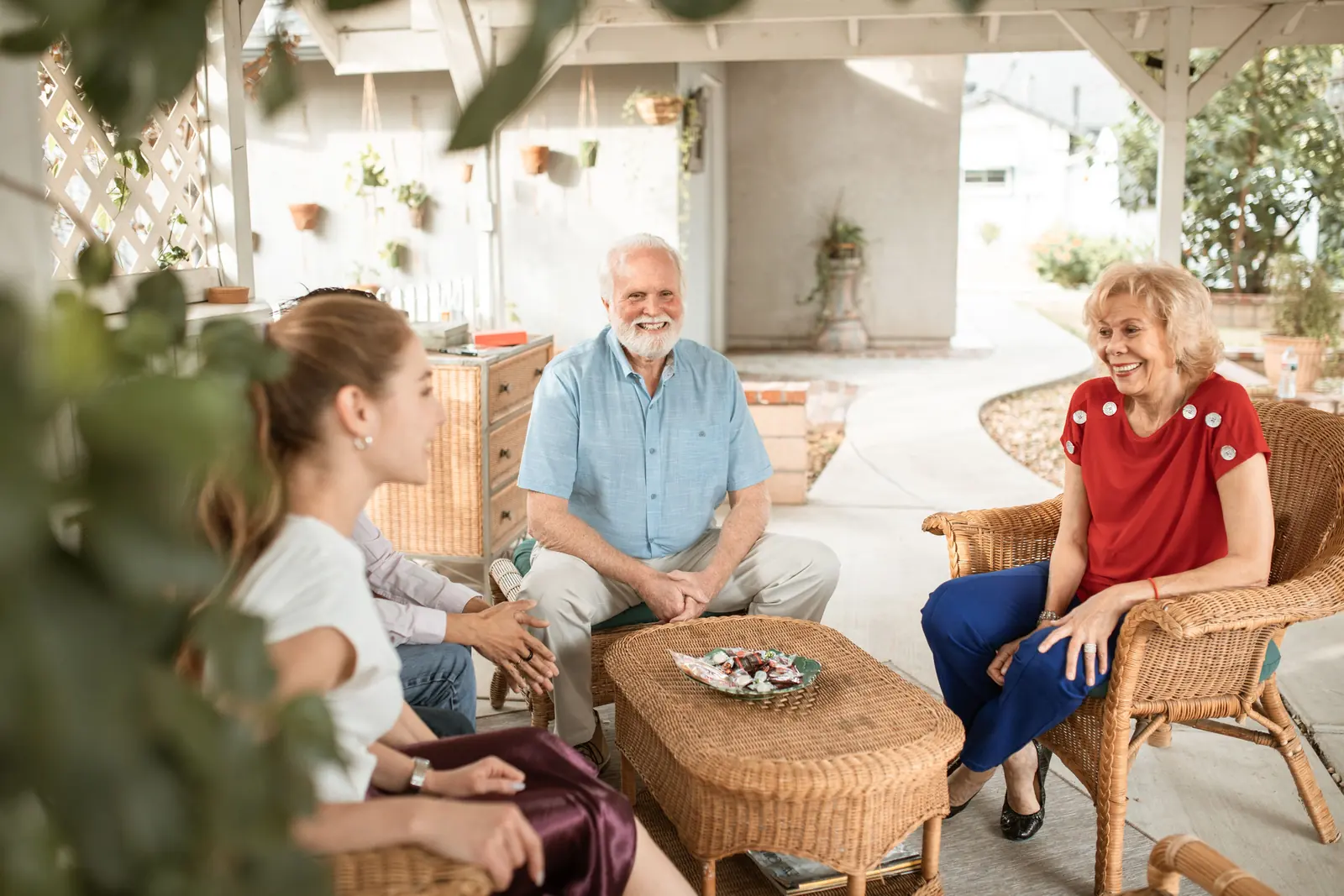 People of different generations sitting and talking together in a warm room